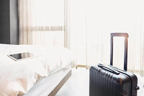 Hotel room with unpacked luggage